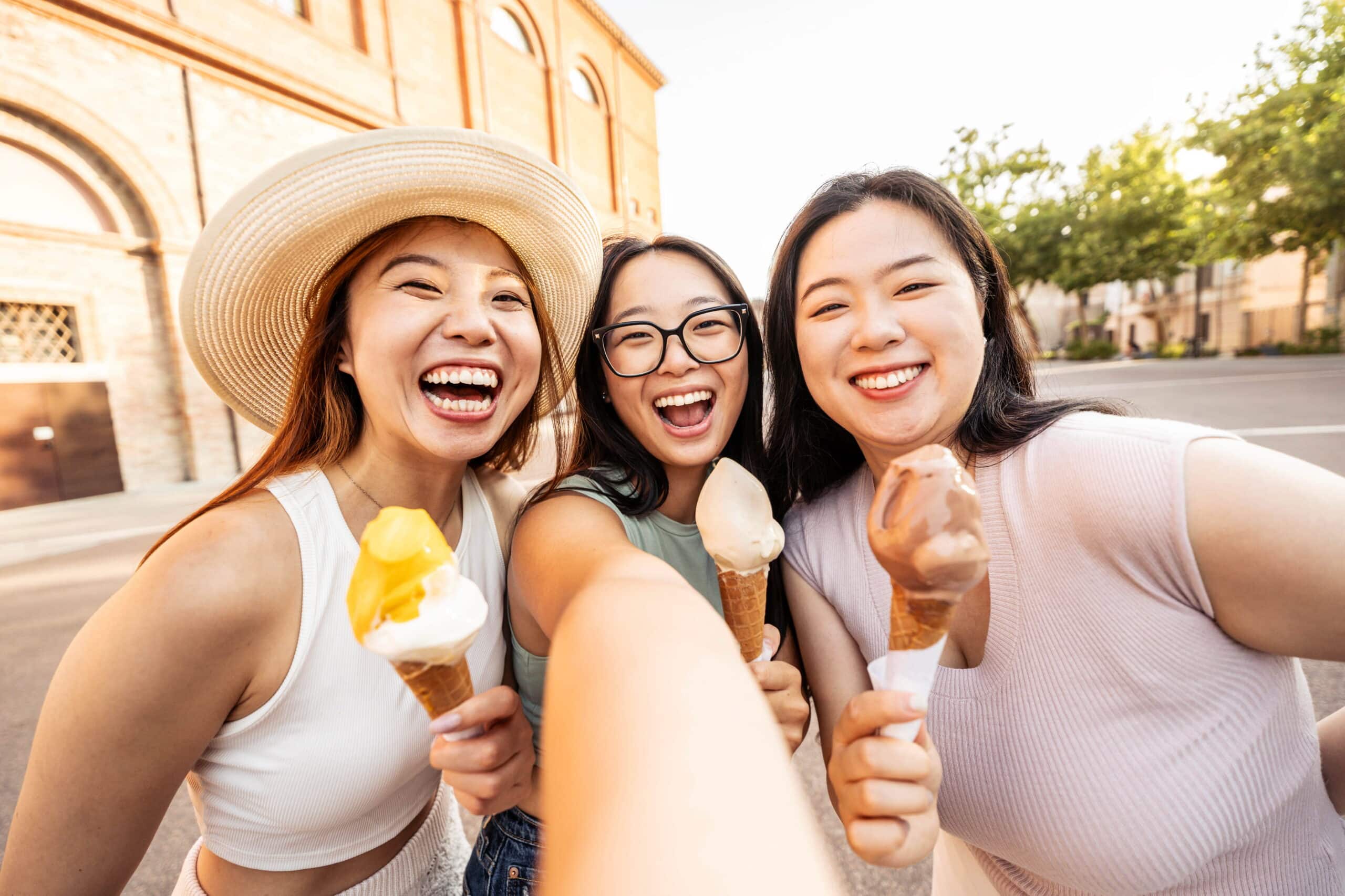 three asian young women enjoying summer vacation