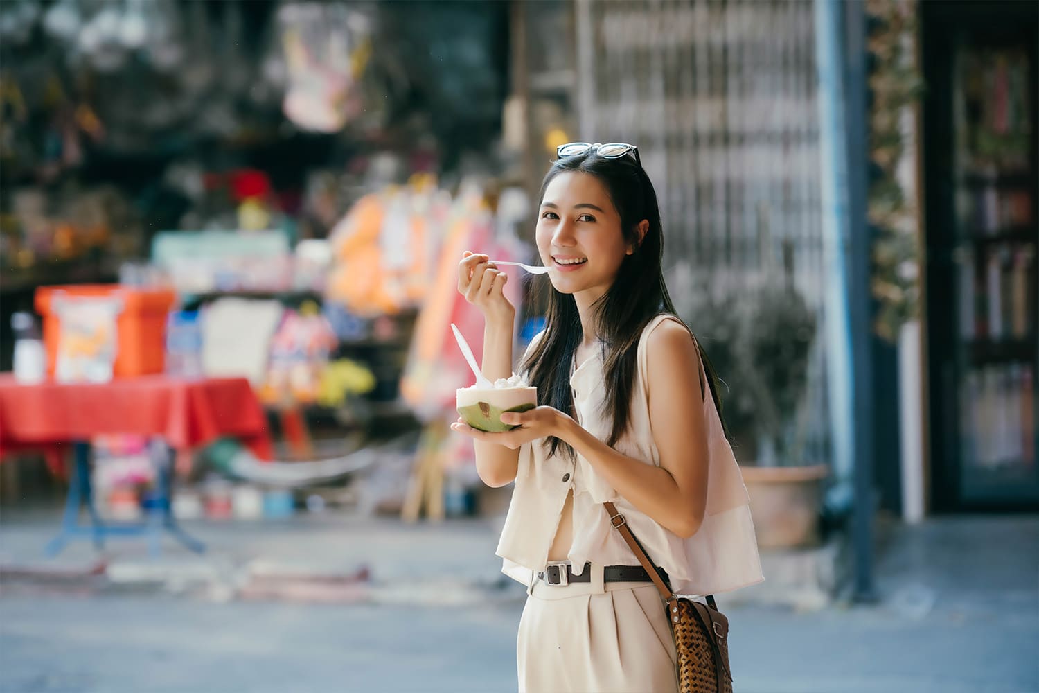 woman smiling while eating