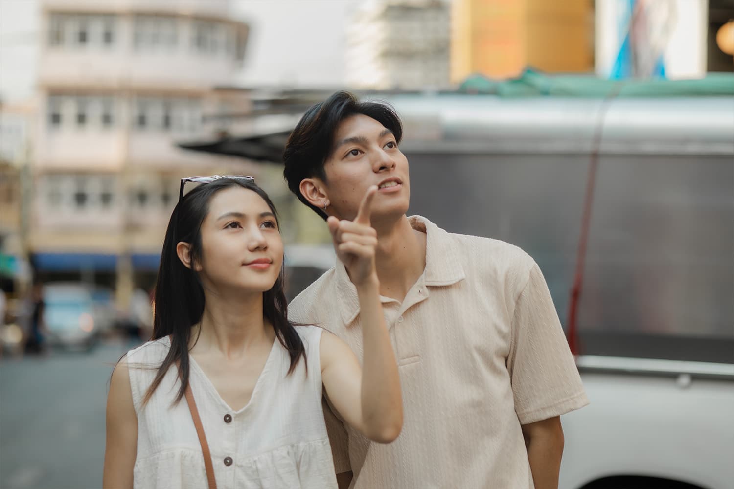 couple pointing at a distance